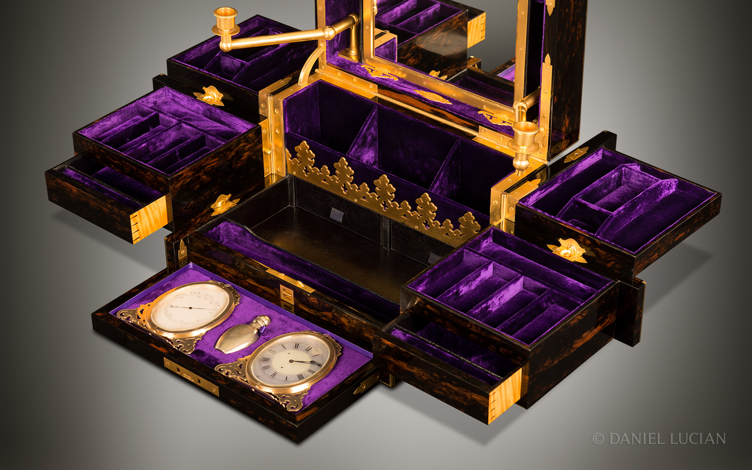 Asprey Antique Jewellery Box in Coromandel with Betjemann Patent mechanism and candlesticks.