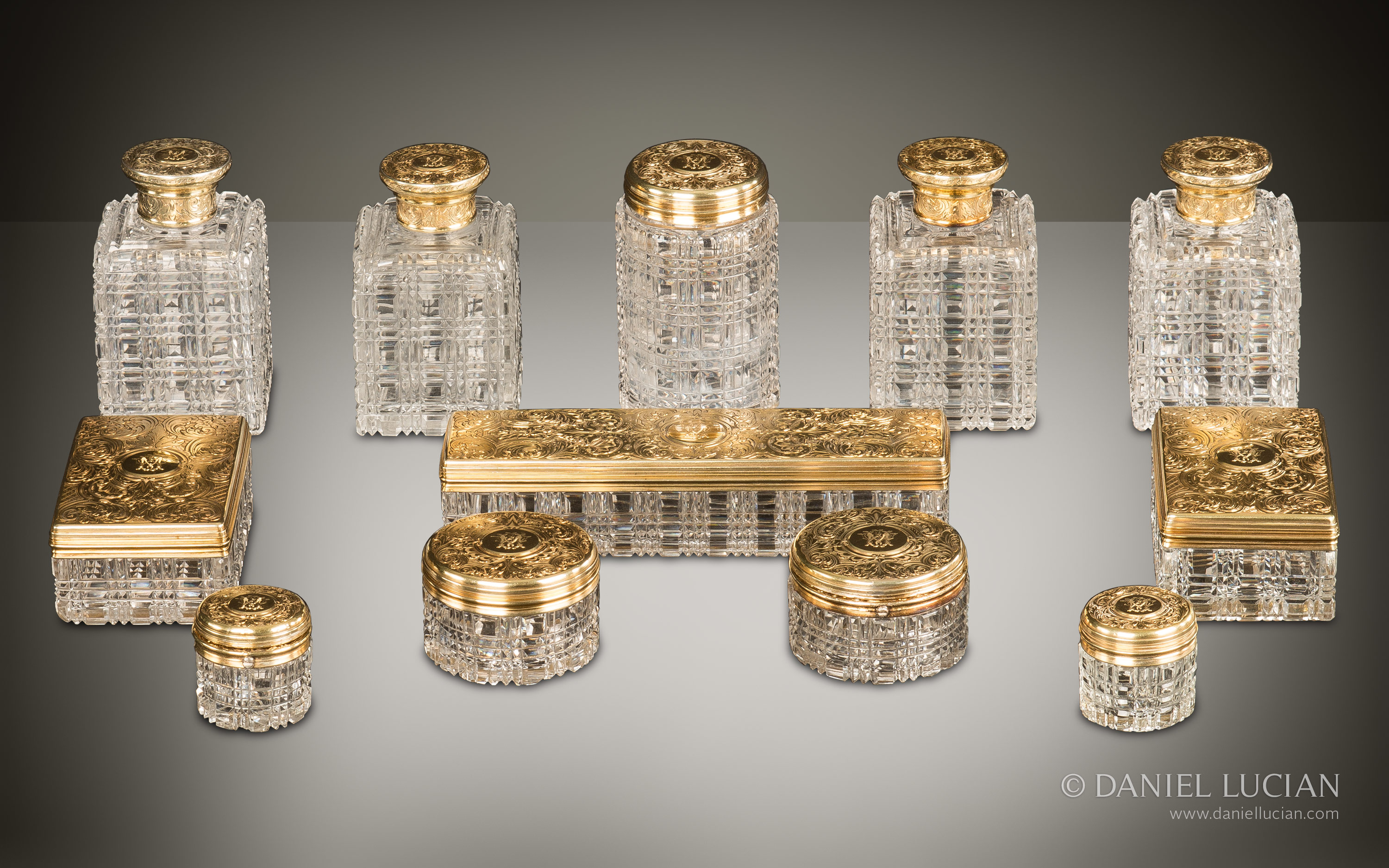 Antique dressing case bottles and jars with silver-gilt / gold fittings by Asprey.