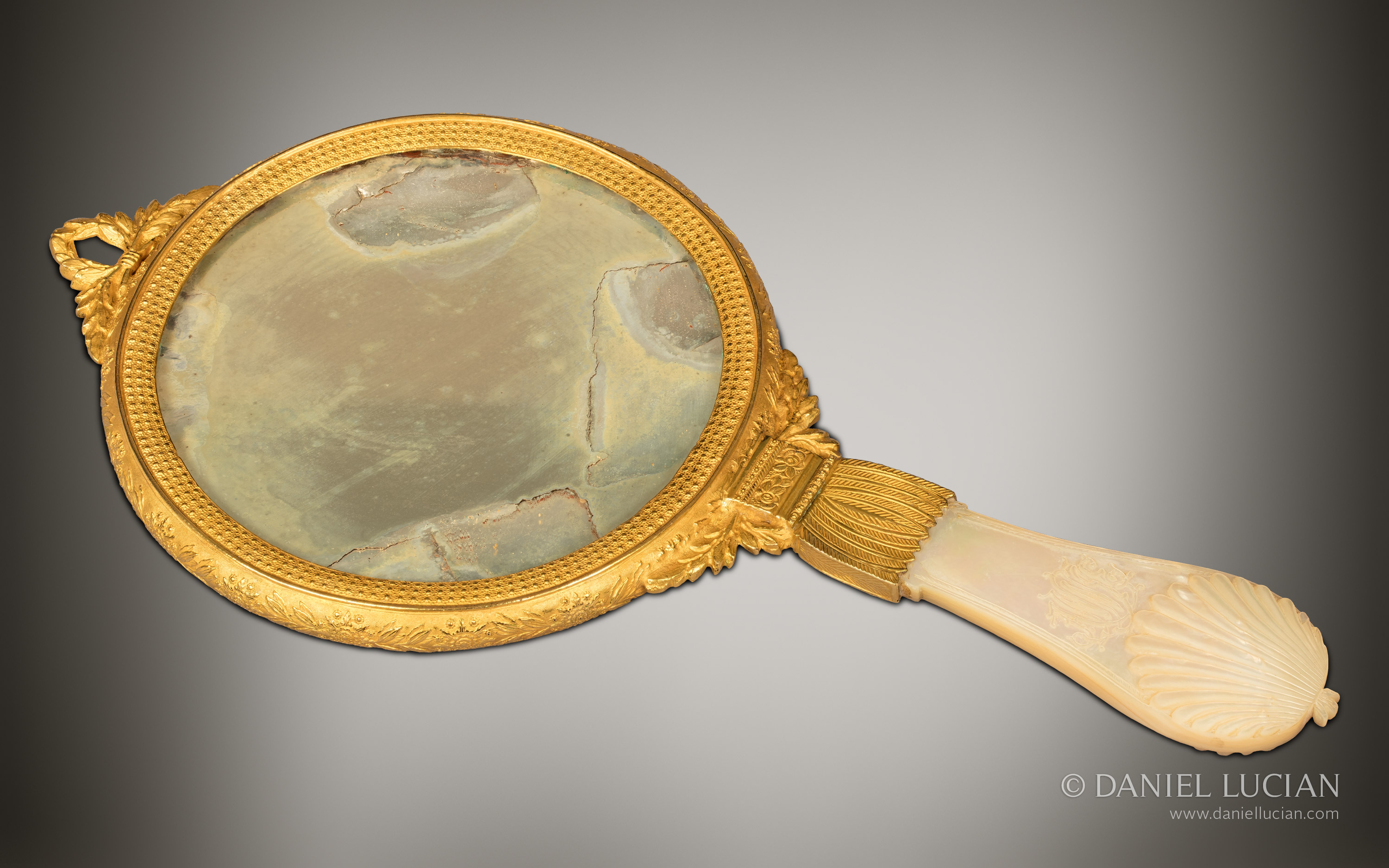 Sculpted mother of pearl handled face mirror belonging to an antique dressing case from Asprey, displayed at the Great Exhibition of 1851.