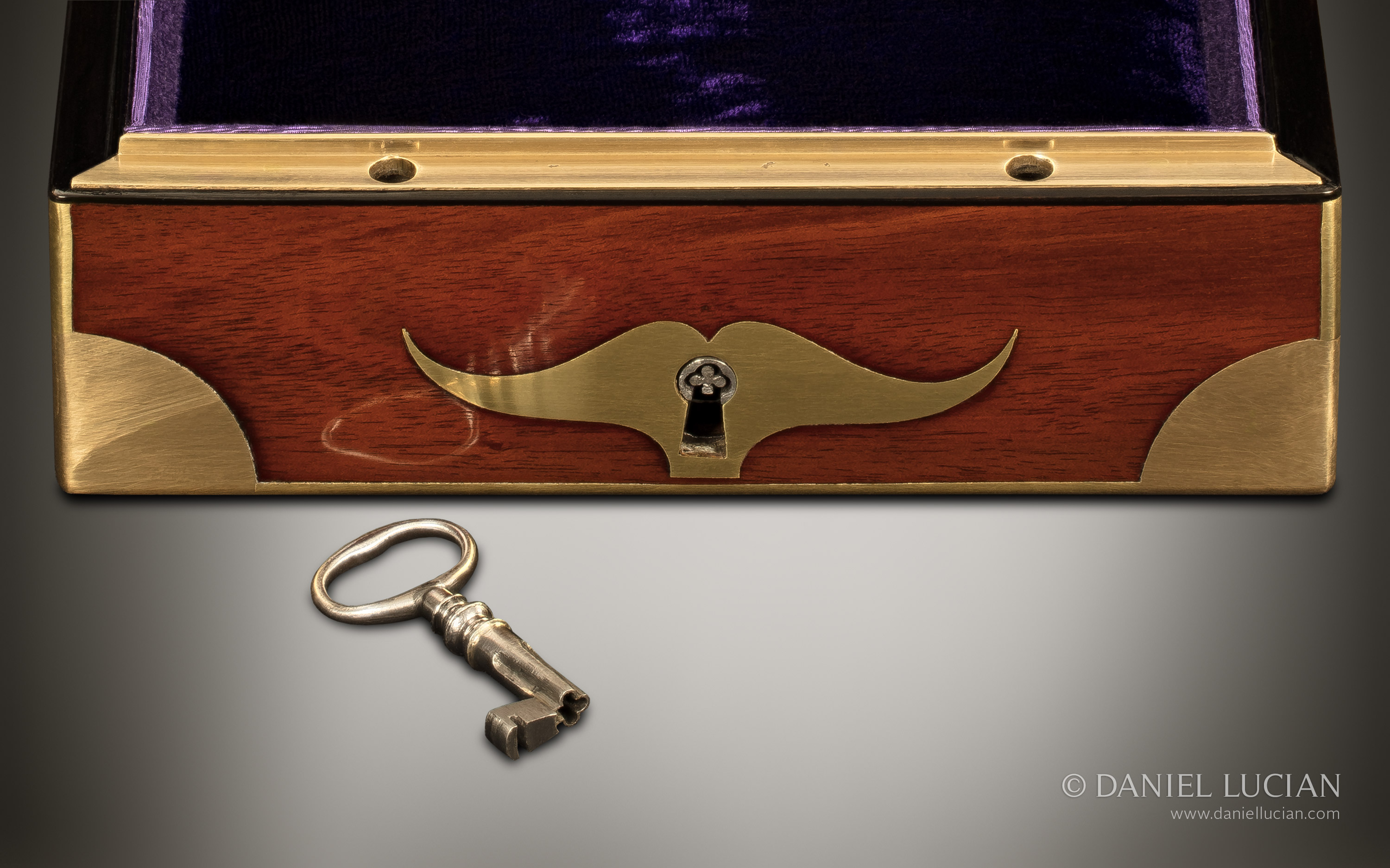 Circular entry points to the lock housing, and a cloverleaf (tréfle) shaped lock drill pin and key from a French antique jewellery box in palisander wood.