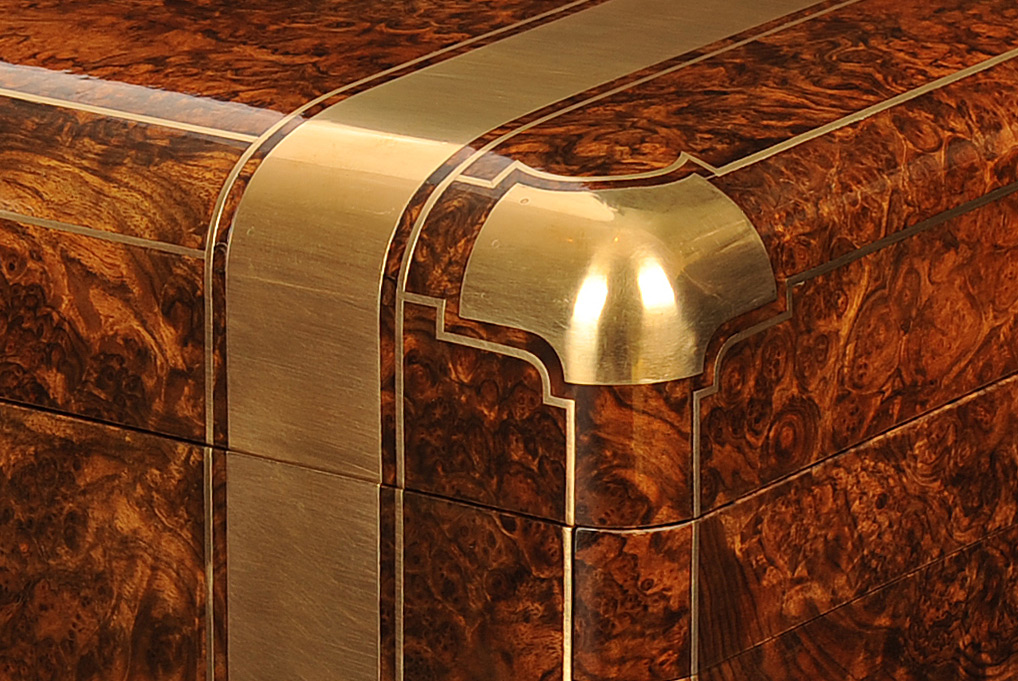 Brass binding and corner mount from an antique jewellery box in burr walnut with cantilever mechanism.