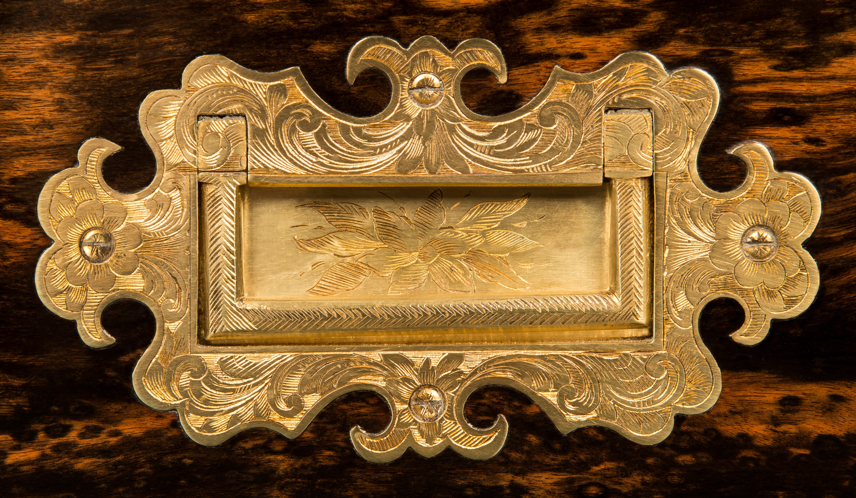 Neoclassical style engraved brass side handle from an antique jewellery box in coromandel with brass inlay.