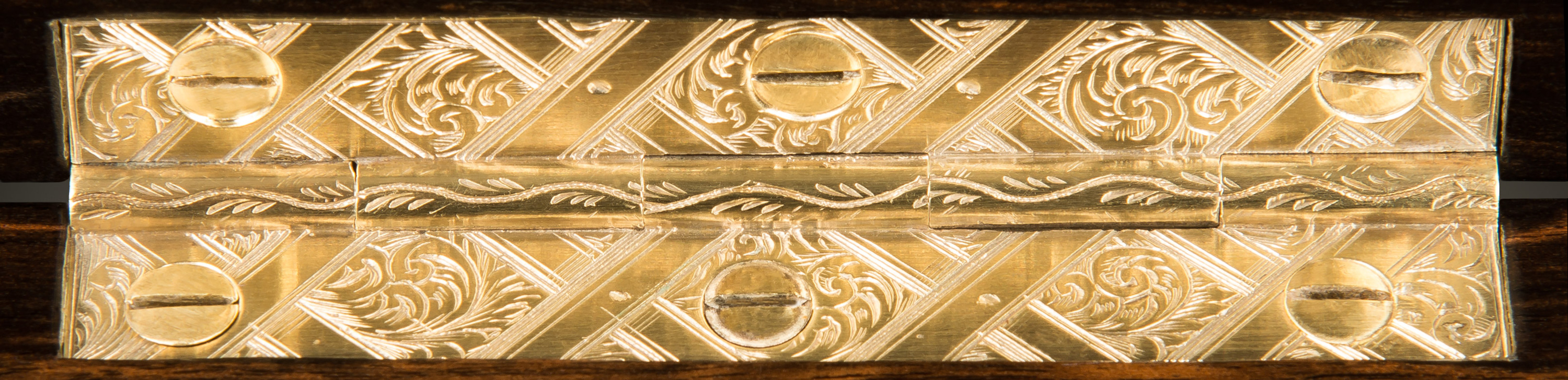 Antique brass hinge with 'bright-cut' engraved decoration.