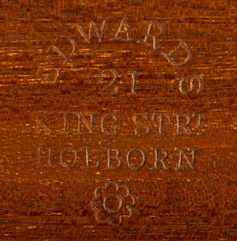 A stamp of ‘Edwards, 21 King Strt, Holborn’ impressed into mahogany.