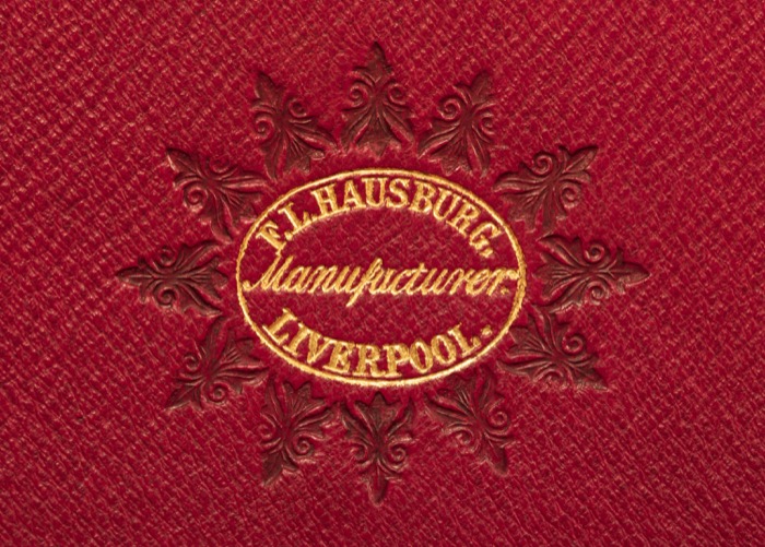 F. L Hausburg manufacturer’s mark gold tooled onto leather from an 1852 antique dressing case in burr walnut.