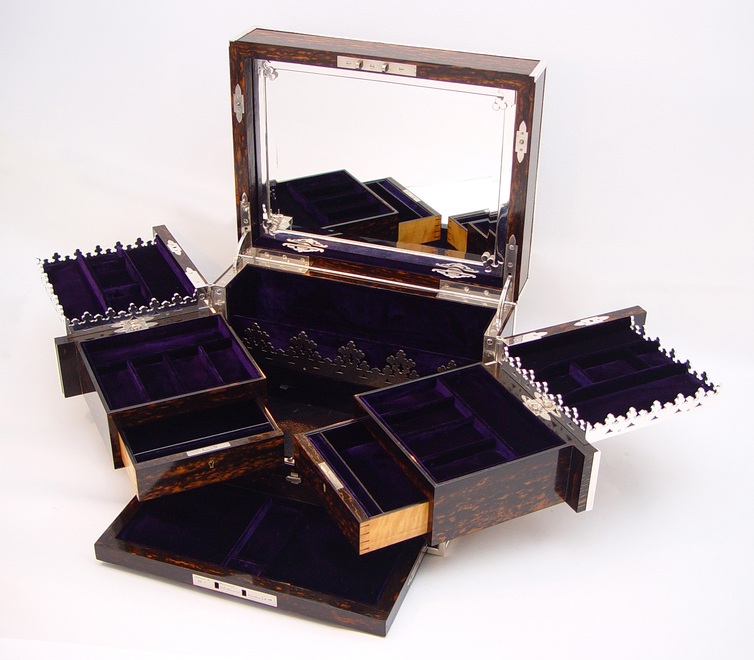 Antique jewellery box in coromandel with Betjemann Patent mechanism.