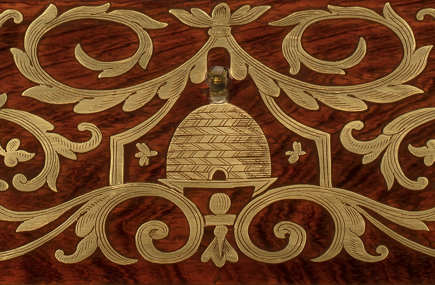Brass inlaid Freemasonic emblem taken from an antique jewellery box in rosewood.